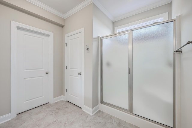 bathroom featuring ornamental molding and an enclosed shower