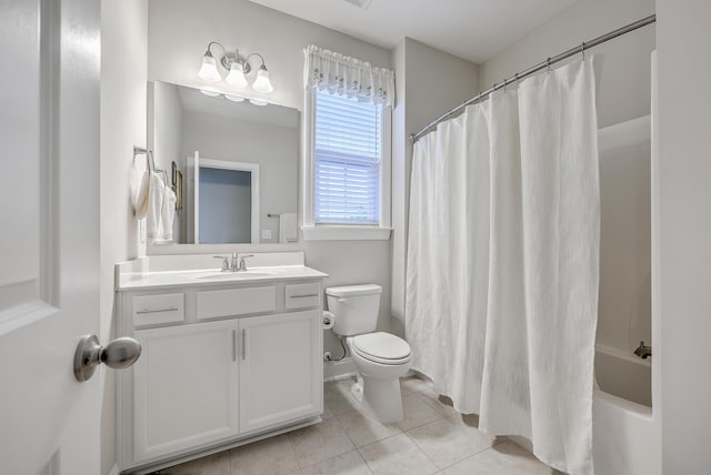 full bathroom with vanity, tile patterned floors, toilet, and shower / bath combo with shower curtain