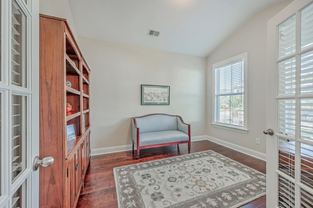 sitting room featuring lofted ceiling, dark hardwood / wood-style floors, and french doors