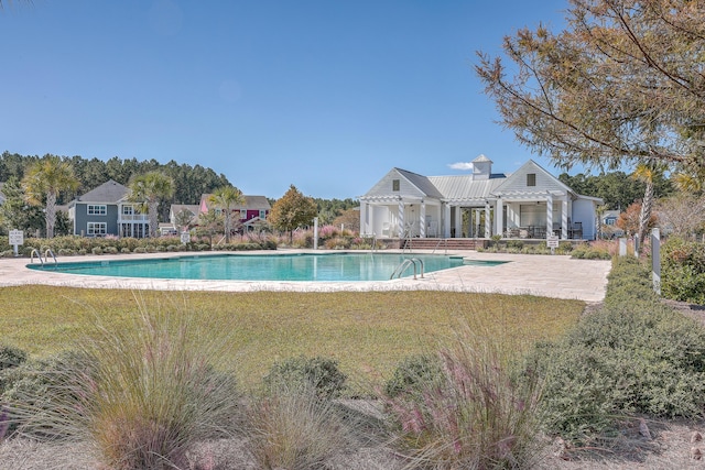 view of swimming pool with a pergola, a lawn, and a patio