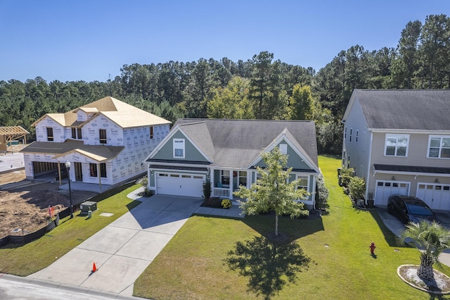 view of front of home with covered porch and a front lawn