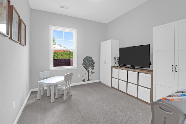 interior space with baseboards, carpet, and visible vents