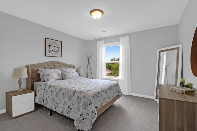 carpeted bedroom with baseboards and visible vents