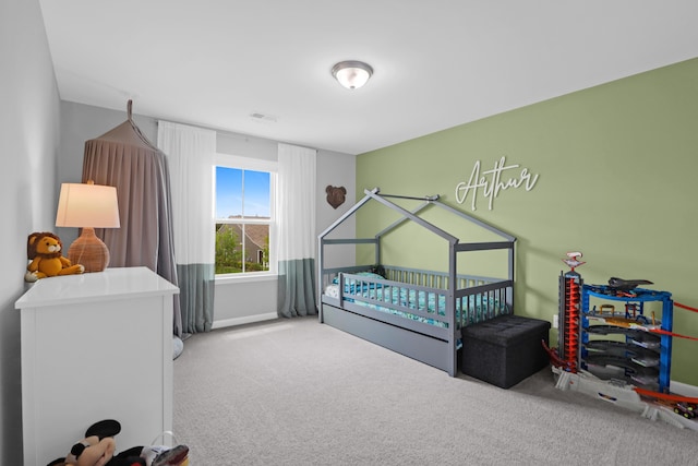 bedroom with carpet flooring, baseboards, and visible vents