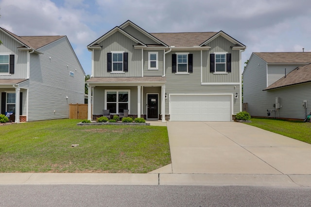 craftsman-style home featuring a garage, board and batten siding, concrete driveway, and a front lawn