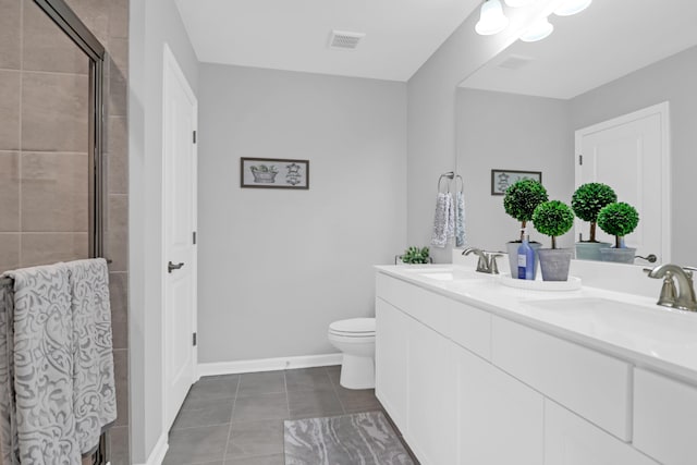 full bathroom featuring a sink, a shower stall, double vanity, and visible vents