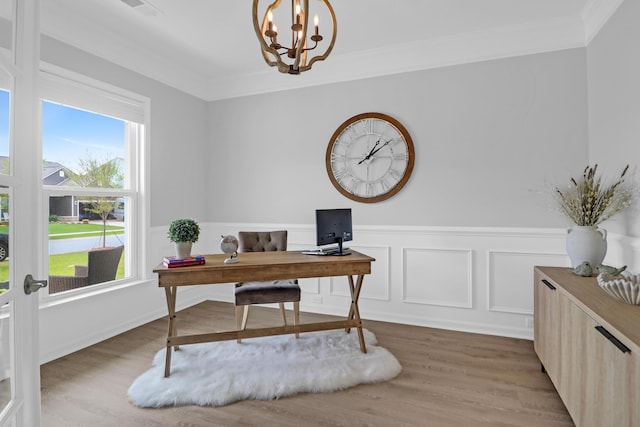 office with ornamental molding, wainscoting, wood finished floors, and a notable chandelier