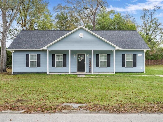 single story home featuring a front lawn