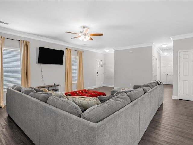 living room featuring dark hardwood / wood-style flooring, ceiling fan, and crown molding