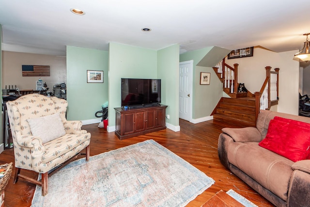 living room with recessed lighting, stairway, baseboards, and wood finished floors