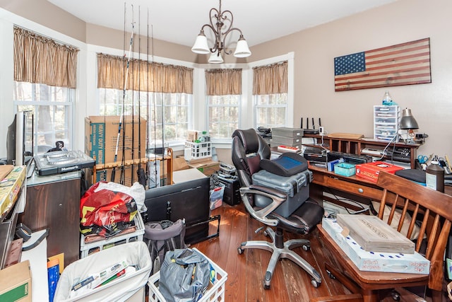 office space with a chandelier and wood finished floors