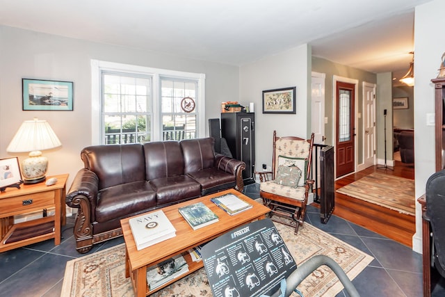 living room with dark tile patterned floors