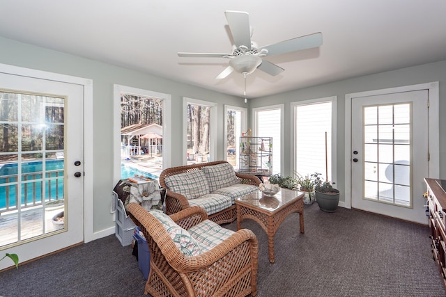 sunroom / solarium with ceiling fan