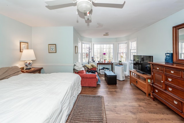 bedroom with wood finished floors and a ceiling fan