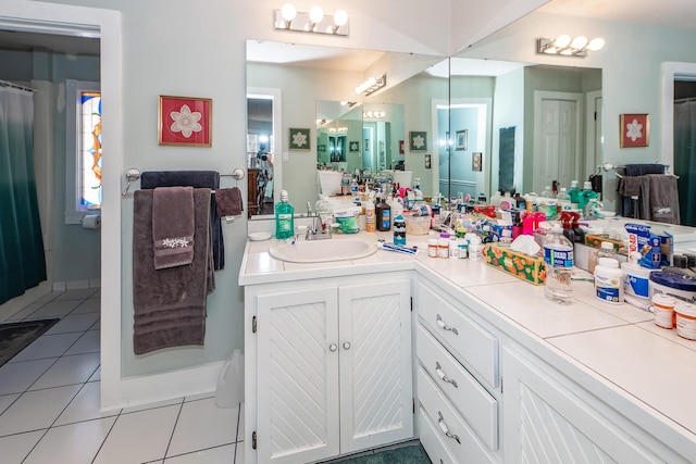 bathroom featuring tile patterned flooring and vanity