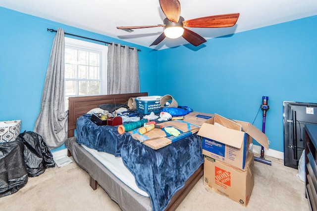 bedroom with carpet, ceiling fan, and baseboards