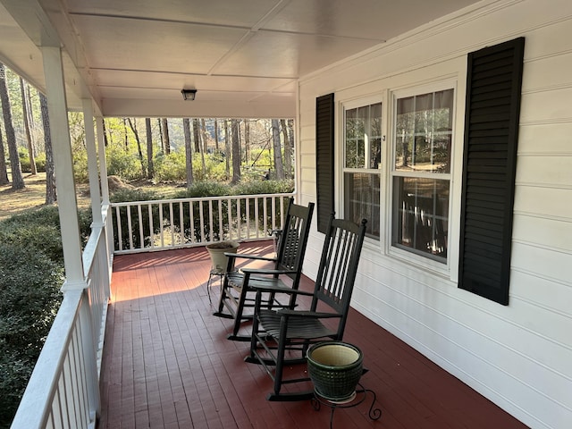 wooden deck featuring covered porch