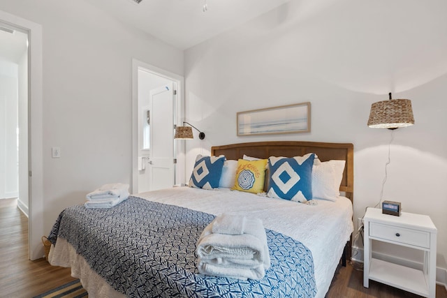 bedroom with wood finished floors