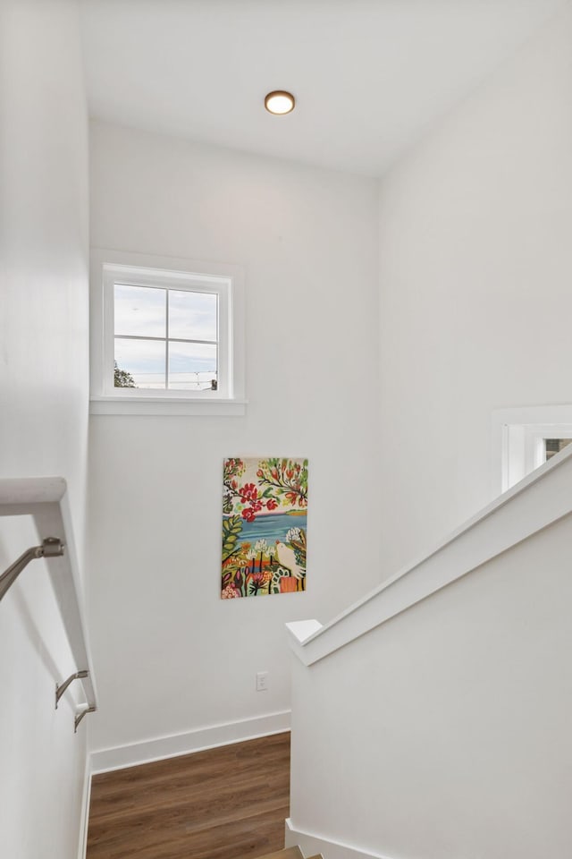 staircase with recessed lighting, baseboards, and wood finished floors