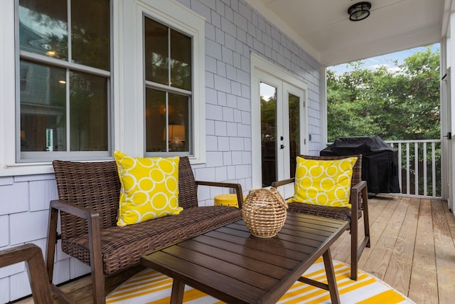 wooden terrace with french doors and a grill