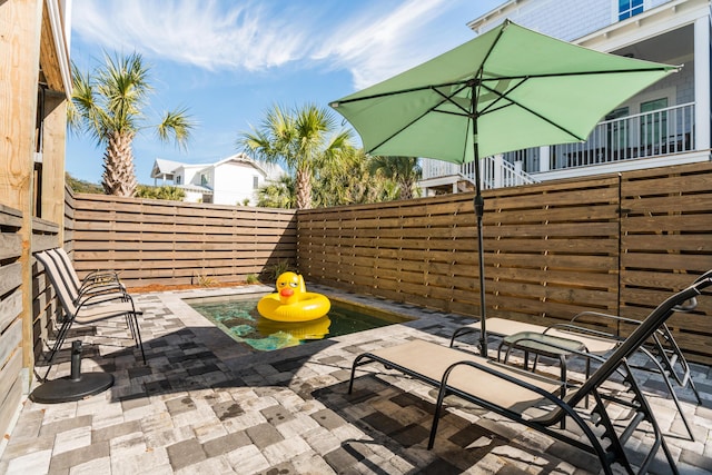 view of patio with a fenced backyard