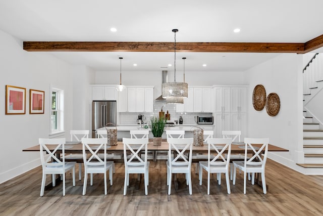 dining area with baseboards, recessed lighting, stairs, light wood-style floors, and beamed ceiling