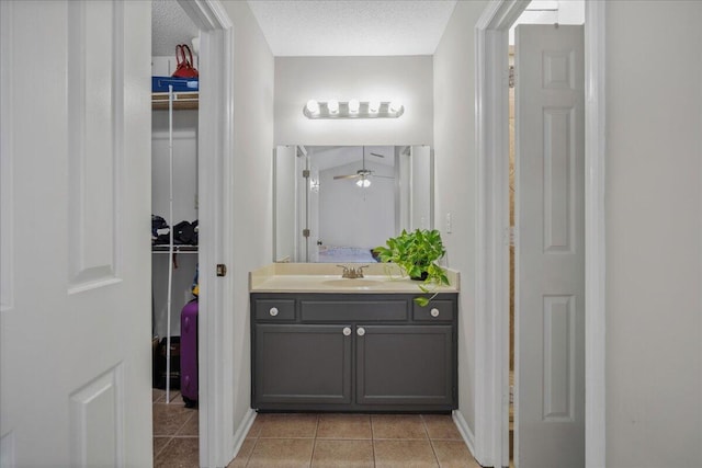 58 Indigo Ln, Goose Creek, SC 29445 - bathroom with vanity, tile patterned floors, a ceiling fan, and a walk in closet