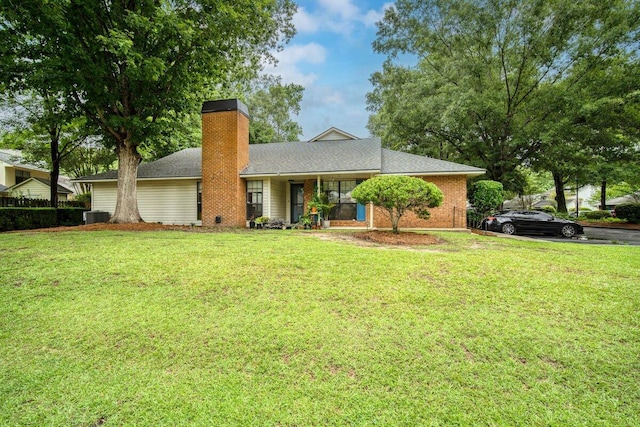 58 Indigo Ln, Goose Creek, SC 29445 - ranch-style house featuring a chimney, a front yard, cooling unit, and brick siding