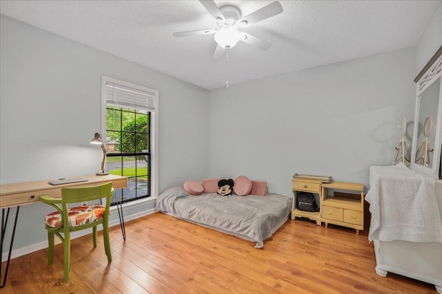58 Indigo Ln, Goose Creek, SC 29445 - bedroom with wood finished floors, baseboards, and a textured ceiling