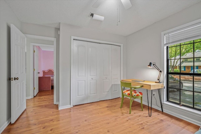 58 Indigo Ln, Goose Creek, SC 29445 - office space with light wood finished floors, baseboards, ceiling fan, and a textured ceiling