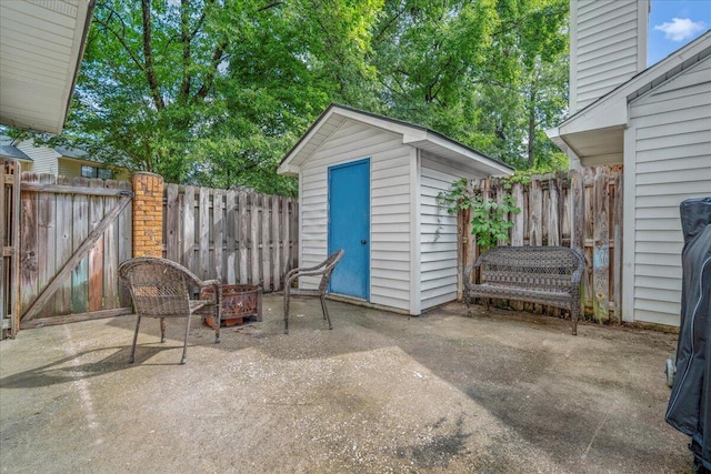 58 Indigo Ln, Goose Creek, SC 29445 - fenced backyard featuring a patio area and a fire pit
