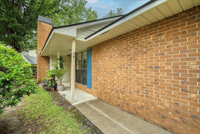 58 Indigo Ln, Goose Creek, SC 29445 - view of home's exterior with brick siding, a chimney, and covered porch