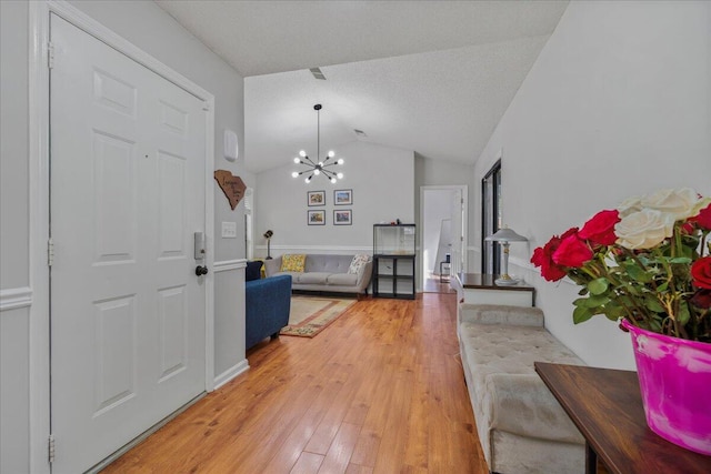 58 Indigo Ln, Goose Creek, SC 29445 - foyer featuring a chandelier, lofted ceiling, and light wood-style flooring