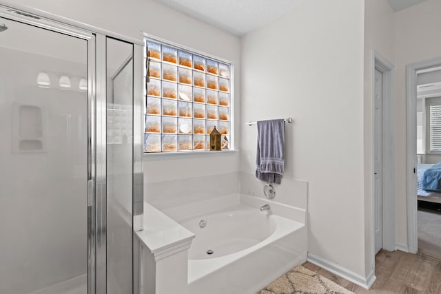 6242 Fieldstone Cir, Charleston, SC 29414 - full bath with a stall shower, a bath, ensuite bath, and wood finished floors