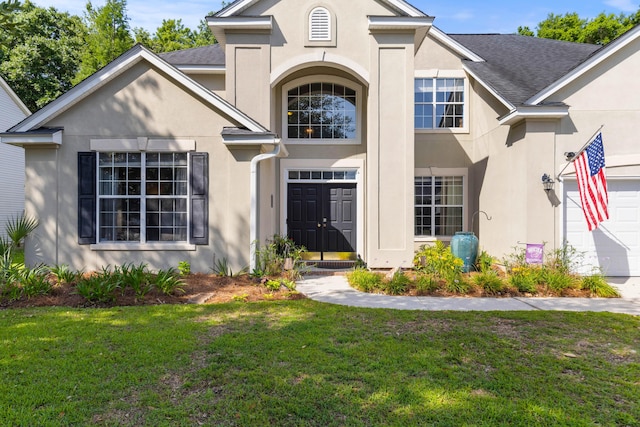 6242 Fieldstone Cir, Charleston, SC 29414 - view of front of home with stucco siding, a front lawn, and roof with shingles