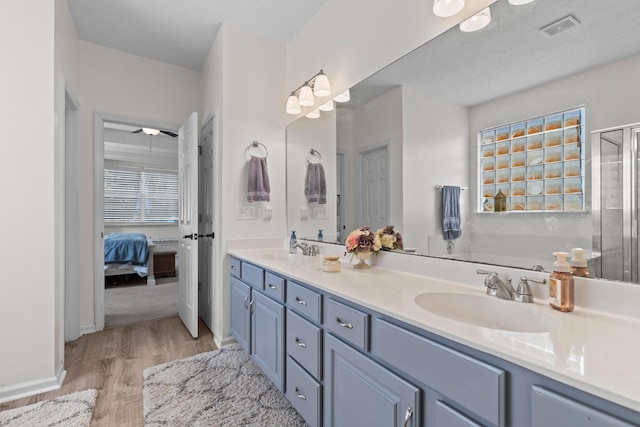 6242 Fieldstone Cir, Charleston, SC 29414 - full bathroom with wood finished floors, ensuite bath, double vanity, and an enclosed shower