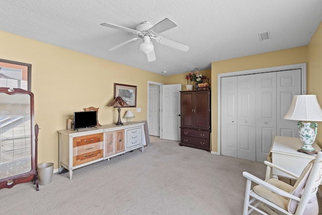 6242 Fieldstone Cir, Charleston, SC 29414 - bedroom featuring light colored carpet, a closet, ceiling fan, and a textured ceiling
