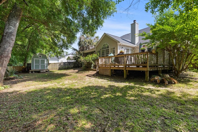 6242 Fieldstone Cir, Charleston, SC 29414 - back of house with a shed, a wooden deck, an outbuilding, and a chimney