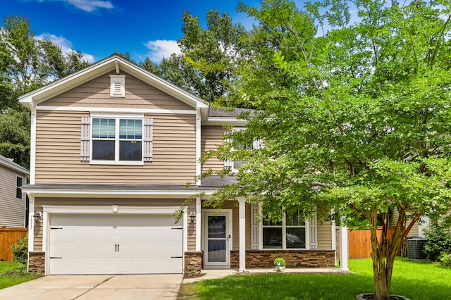 view of front of home with a garage, central air condition unit, and a front lawn