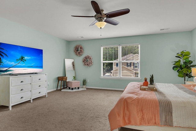 bedroom featuring ceiling fan and light carpet