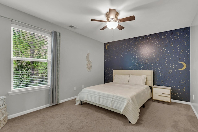 bedroom featuring ceiling fan and carpet