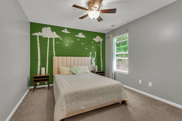 carpeted bedroom with ceiling fan