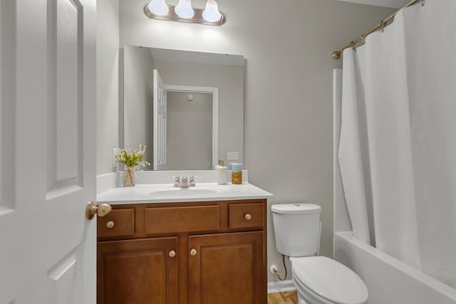 full bathroom featuring shower / bath combination with curtain, toilet, and vanity