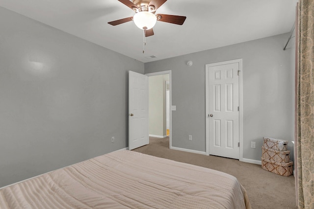 bedroom featuring ceiling fan and carpet