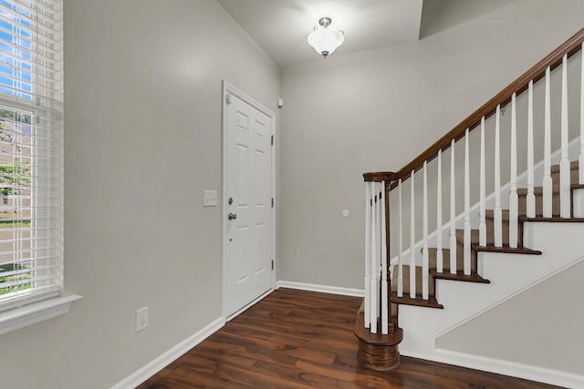 entrance foyer with dark hardwood / wood-style floors