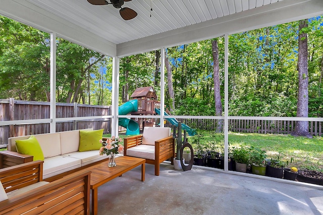 sunroom featuring ceiling fan