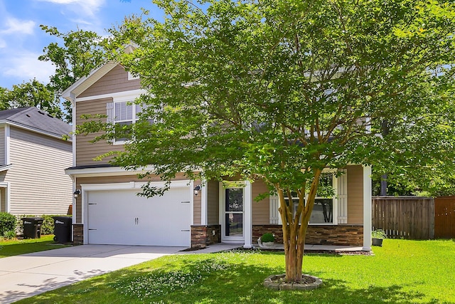 obstructed view of property featuring a front yard and a garage