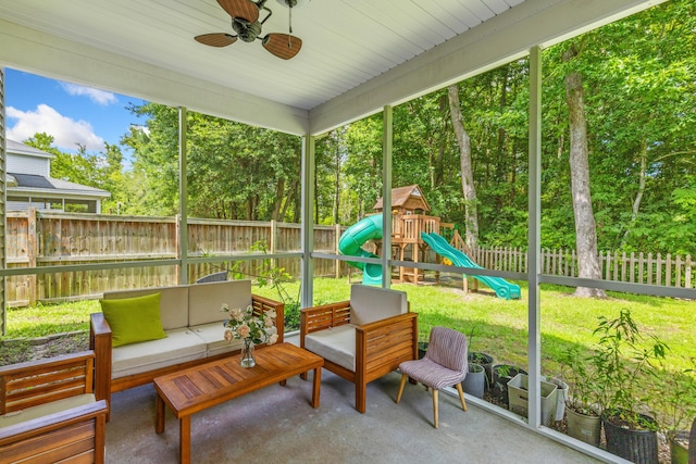 sunroom / solarium featuring ceiling fan