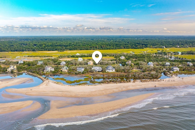 bird's eye view featuring a water view and a view of the beach