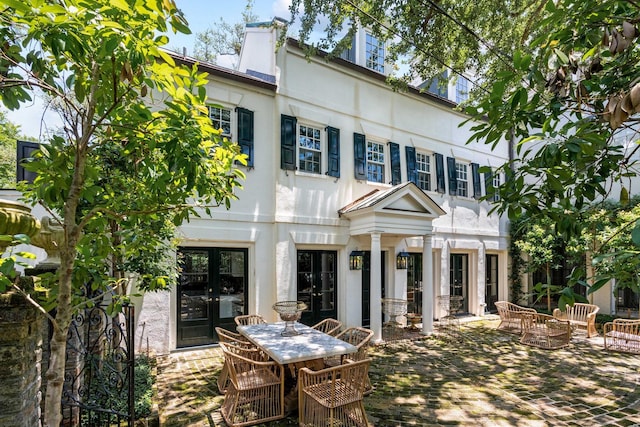 22 Lamboll St Unit C, Charleston, SC 29401 - back of house featuring outdoor dining space, stucco siding, a patio, and french doors
